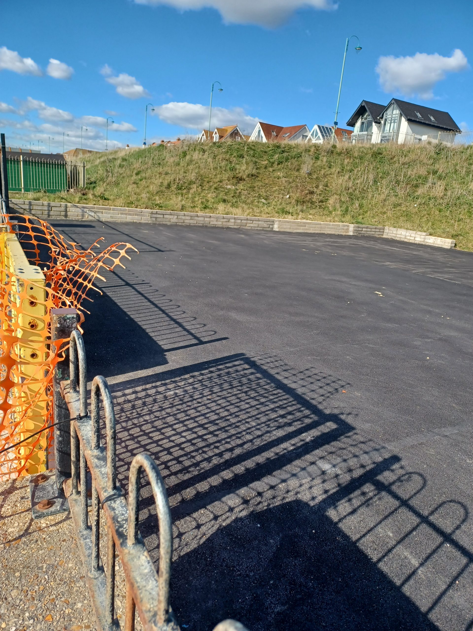An enclosure covered in tarmac that used to be a swimming pool